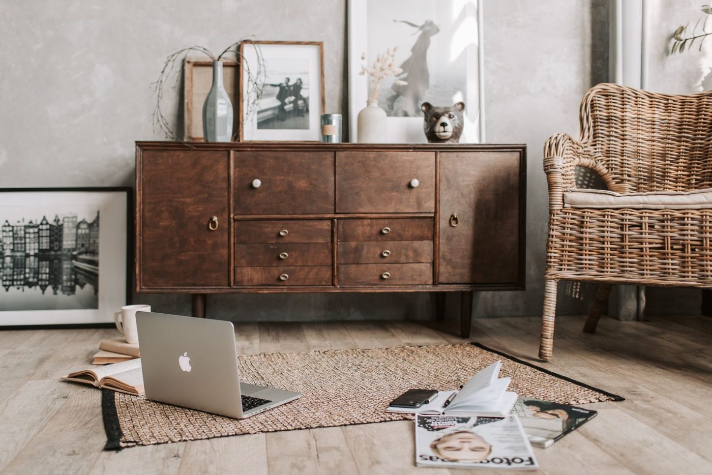 Hands typing on a laptop at a wooden desk