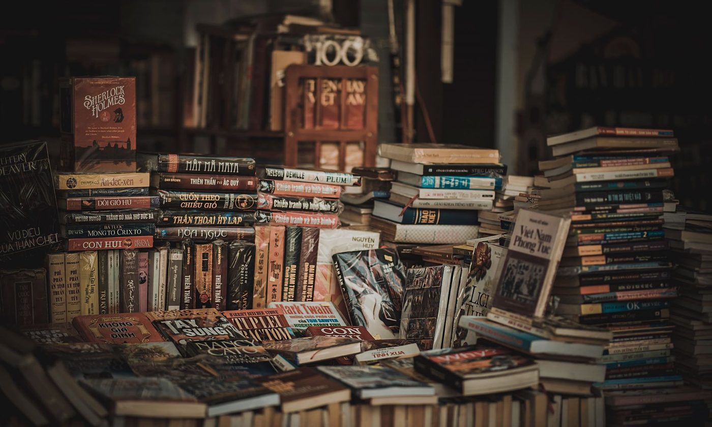 Hardcover books standing in a row on a shelf