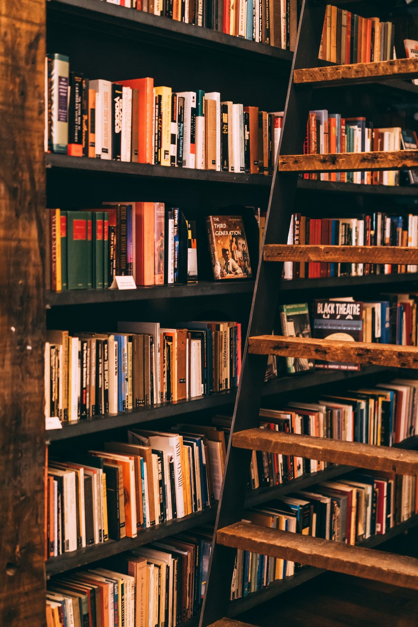 Tall bookshelves filled with books in a library